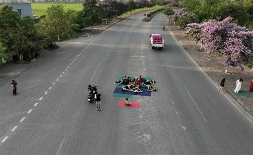 14 people fined for practicing yoga in middle of road