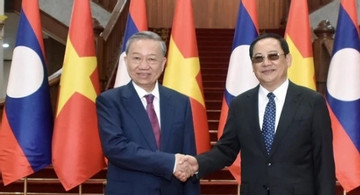 President To Lam meets Lao PM Sonexay Siphandone