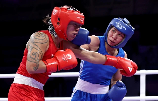 Vietnamese female boxer advances to 2nd qualification round at Paris ...