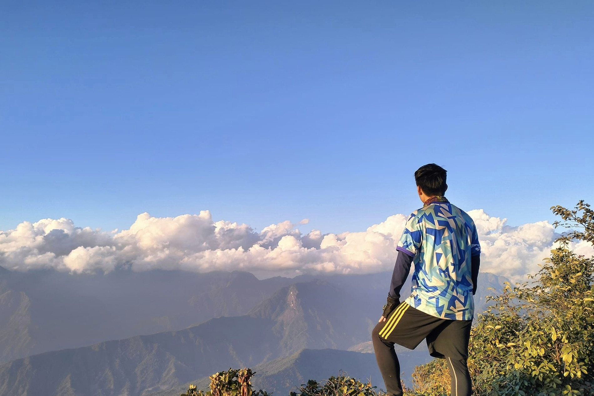 With modest income, young man travels often, climbs dozens of mountains