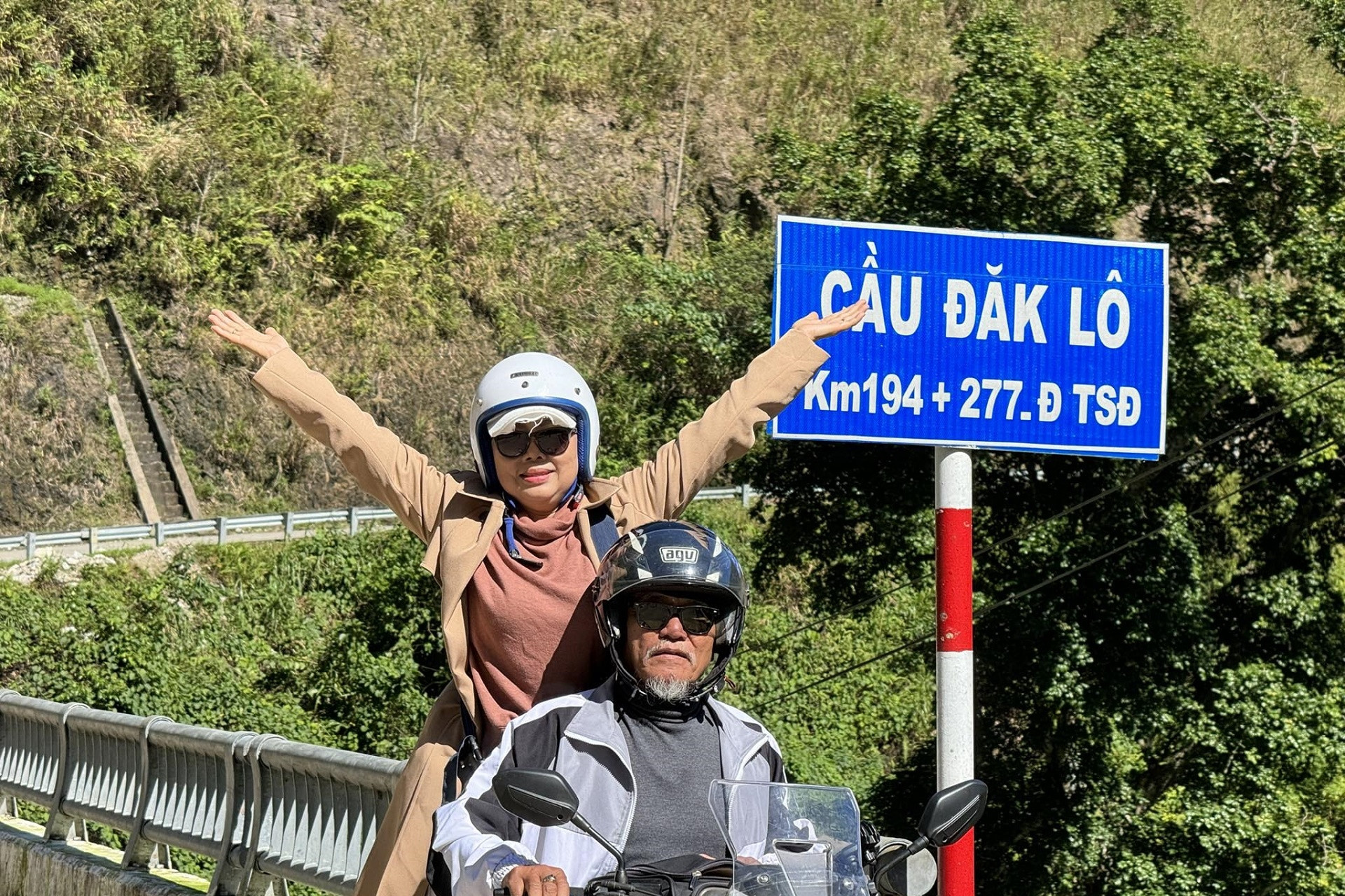 After years of hard work, couple travels by motorbike throughout the country