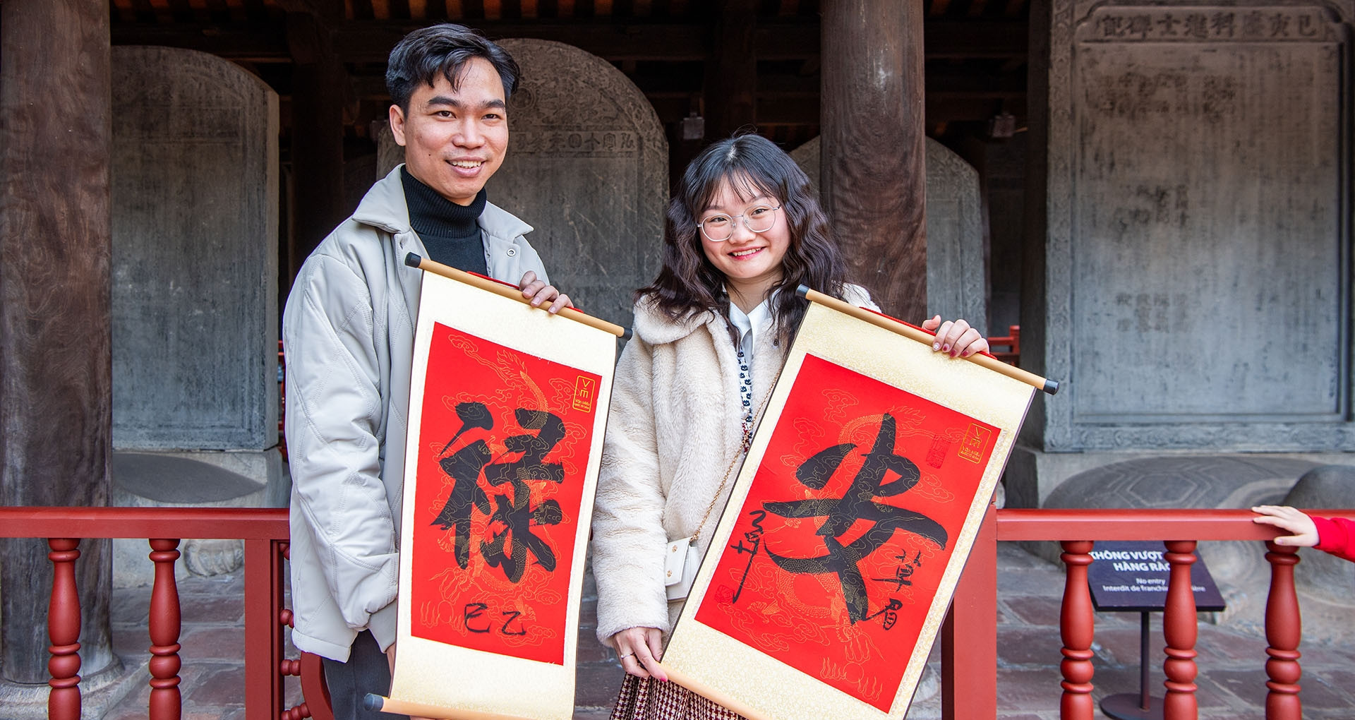 A time-honored tradition: Calligraphy blessings draw crowds to Van Mieu