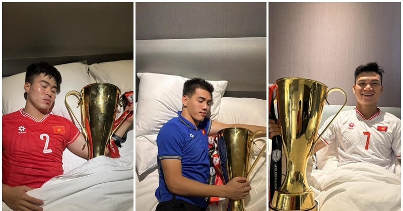 Vietnamese players celebrate victory by sharing the trophy - even in bed!