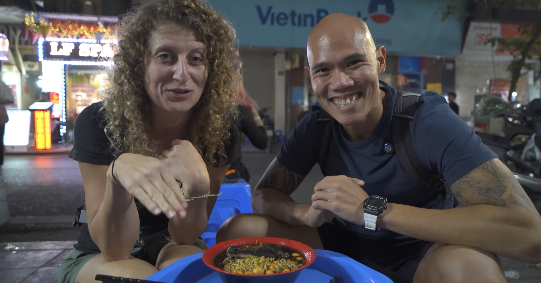 Canadian couple amazed by dark herbal noodles in Hanoi