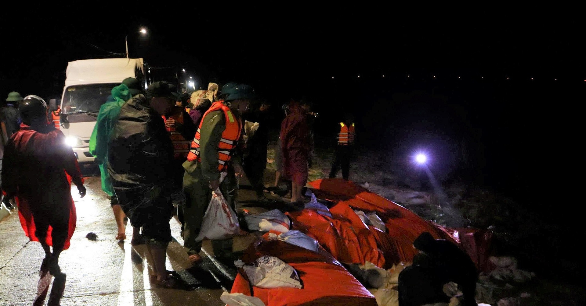 Over 500 soldiers race through the night to save riverside village from collapse