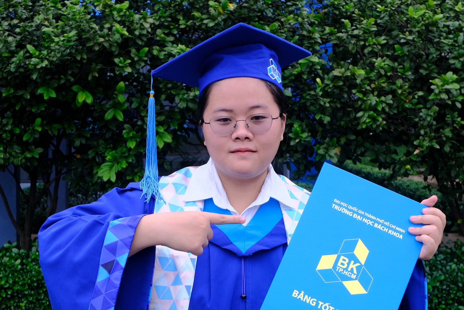 Female student graduates technology school with perfect GPA
