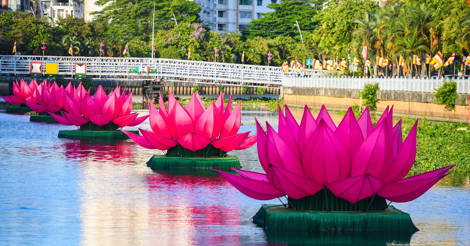 Seven giant lotus flowers illuminate Ho Chi Minh City canal for Vesak 2026